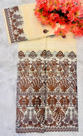 Tissu jaune saumon motif marron brillant